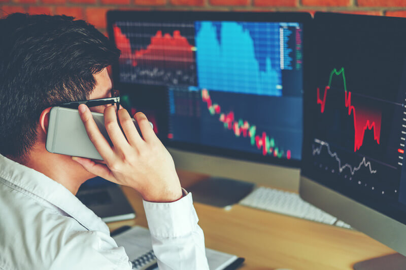 Business Man Using Mobile phone Investment discussing and analysis graph stock market trading,stock chart concept