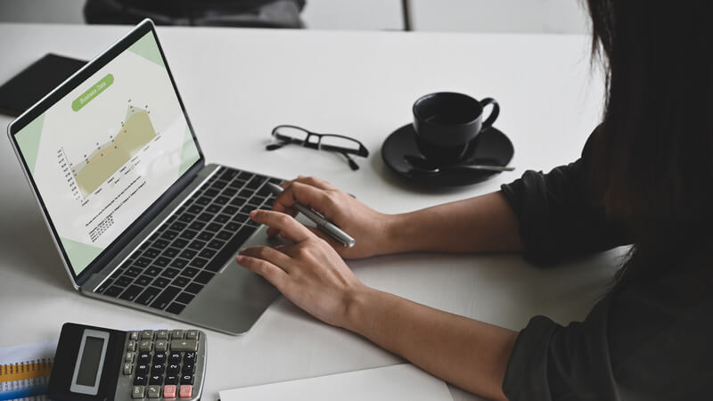 Young businesswoman analysis business data on laptop computer.